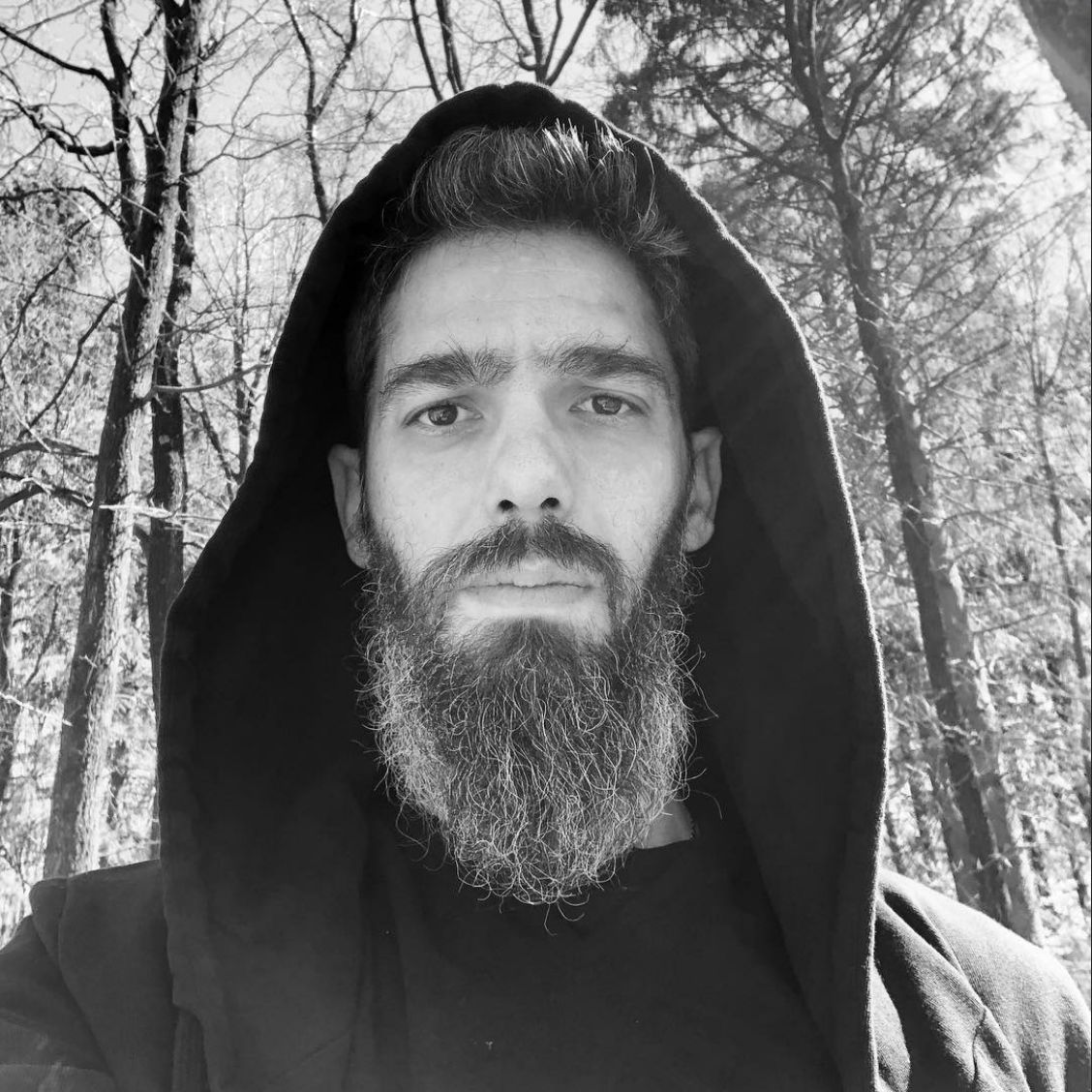 Dionysios Kompotheklas hooded creator portrait
